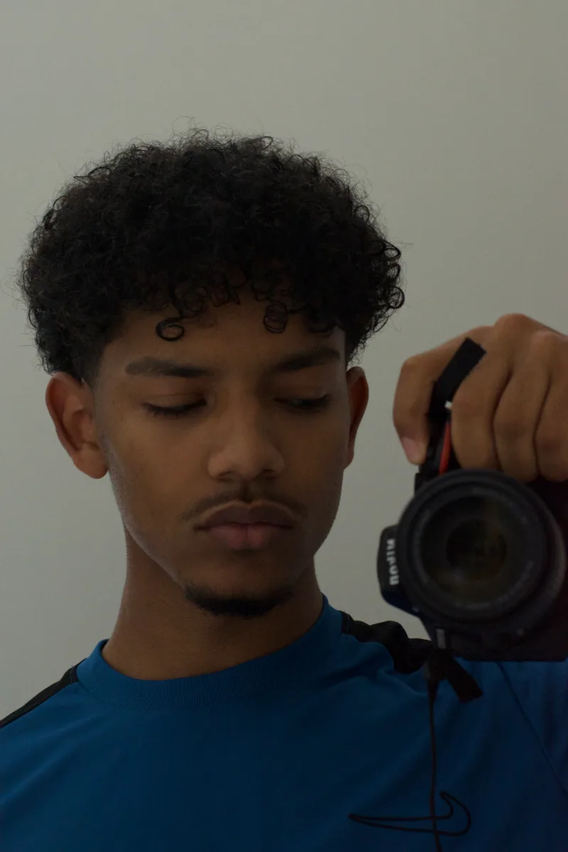 Amin met zijn camera